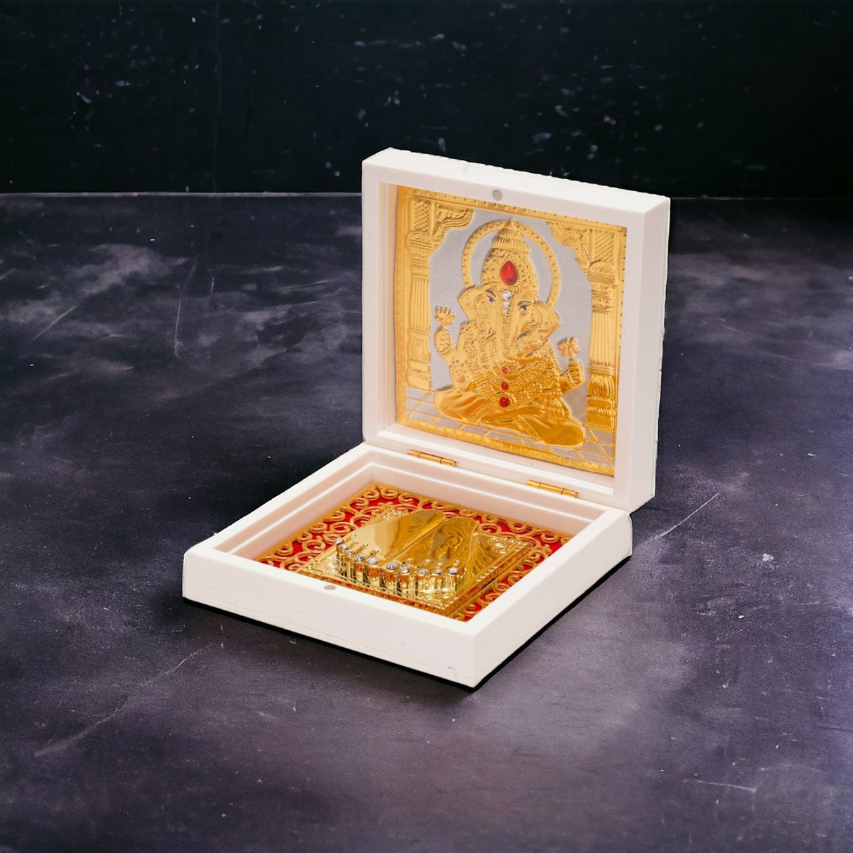 Gold plated ganesha photo frame with charan paduka