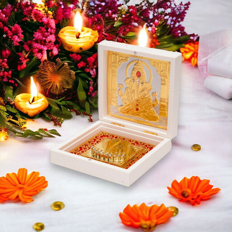 Gold plated ganesha photo frame with charan paduka