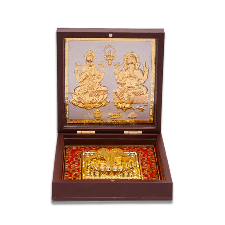 Gold plated laxmi ganesh photo frame with charan paduka