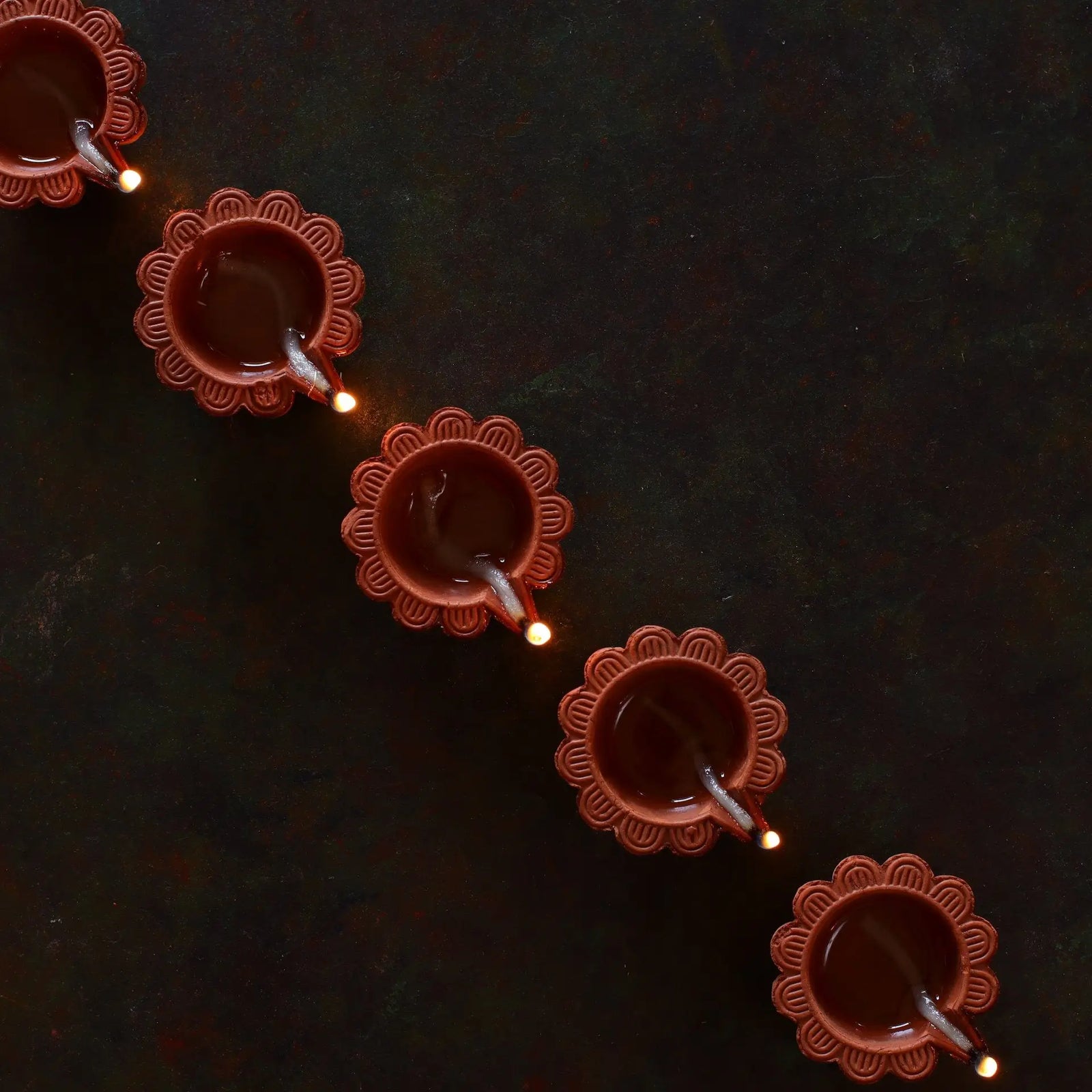 Brighten your home this Diwali with DIY decor ideas like handmade paper lanterns, rangoli designs, mason jar lights, and upcycled diya holders for a festive and personal touch.