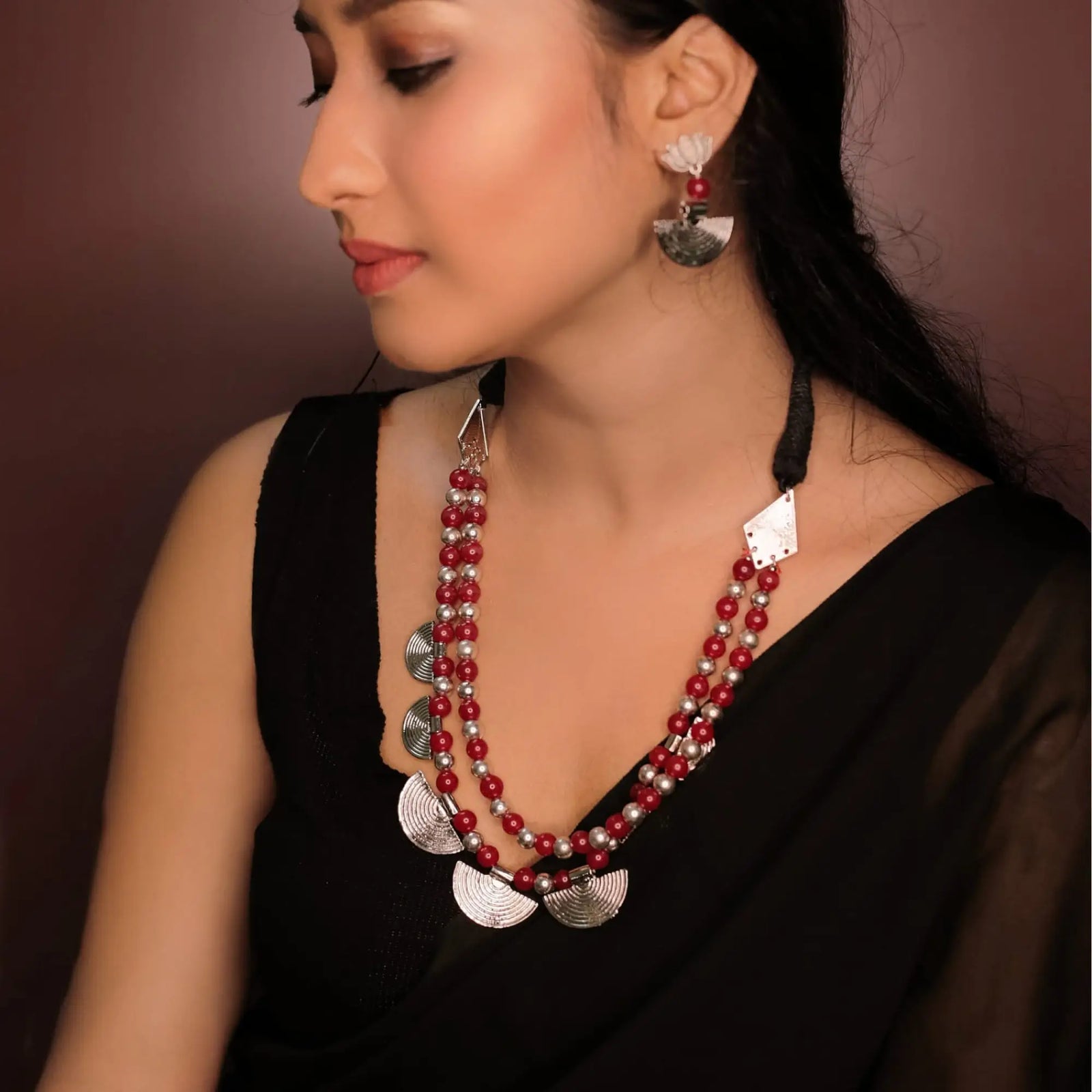 Red and silver beaded necklace with matching earrings showcasing Indian jewelry styles